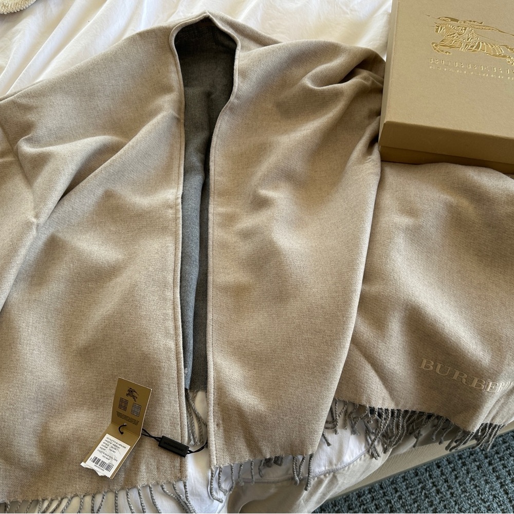 Burberry cape - original tag still on - never worn.  Box included